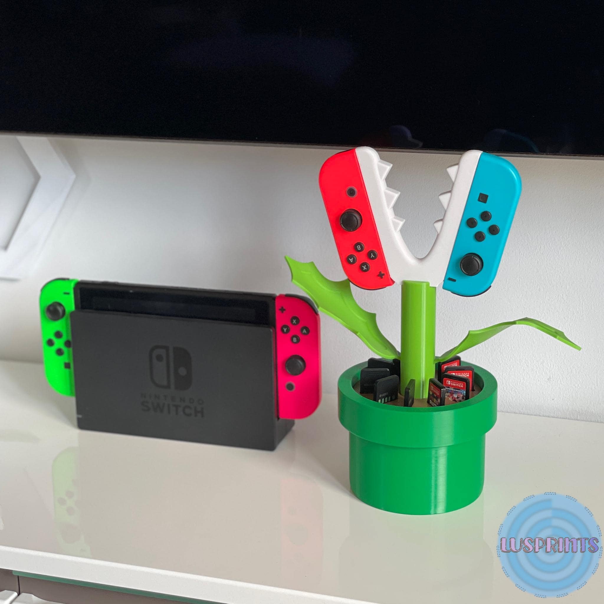 JoyCon & Switch Game Card Organizer, grüne Pflanze mit Slots für bis zu 10 Spielekarten.