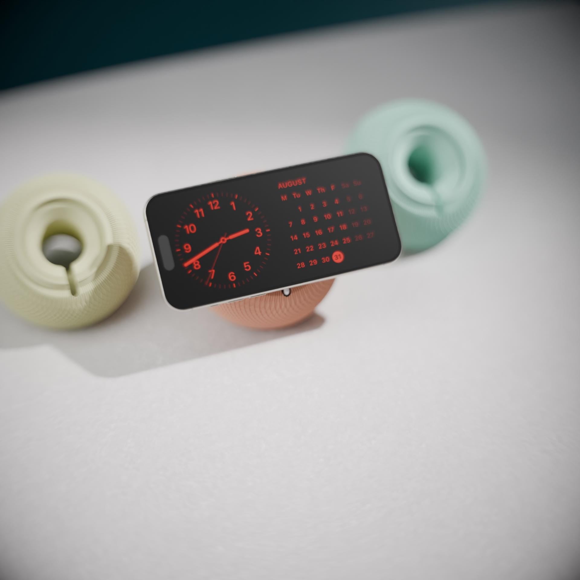 Minimalistischer MagSafe Ladeständer, Nightstand Orbit, 3D gedruckt in sanften Pastellfarben. Die fein texturierte Oberfläche erinnert an den ikonischen HomePod Mini Look und sorgt für ein modernes Tech-Statement auf dem Schreibtisch.